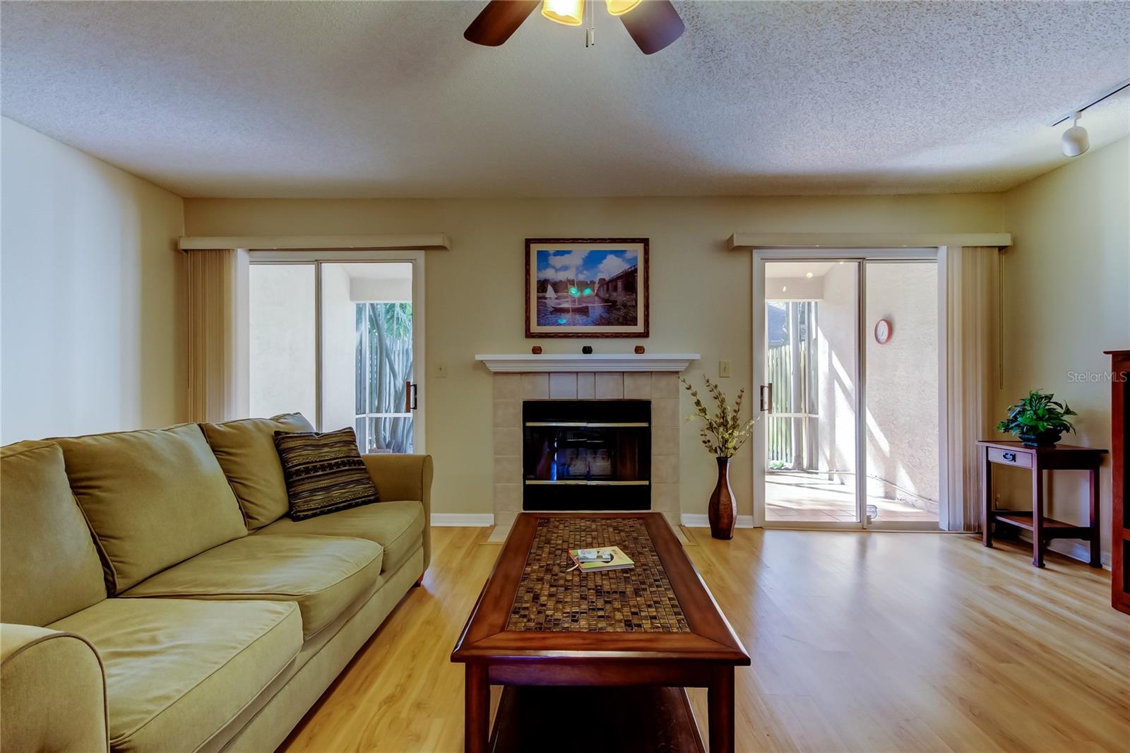 29.  Living Area (19.8' x 16.4') Features Wood Burning Fireplace, Double Sliders, Ceiling Fan...