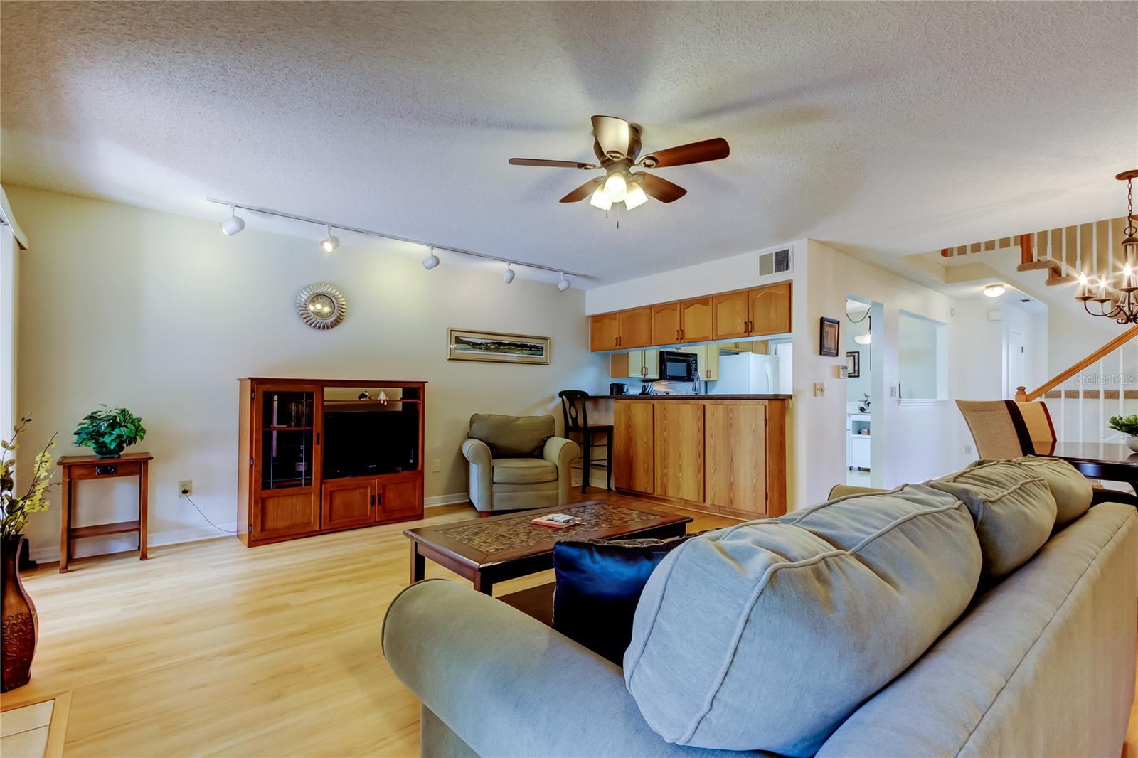 32.  Living Area (19.8' x 16.4') Onlooking the Breakfast Bar off the Kitchen..