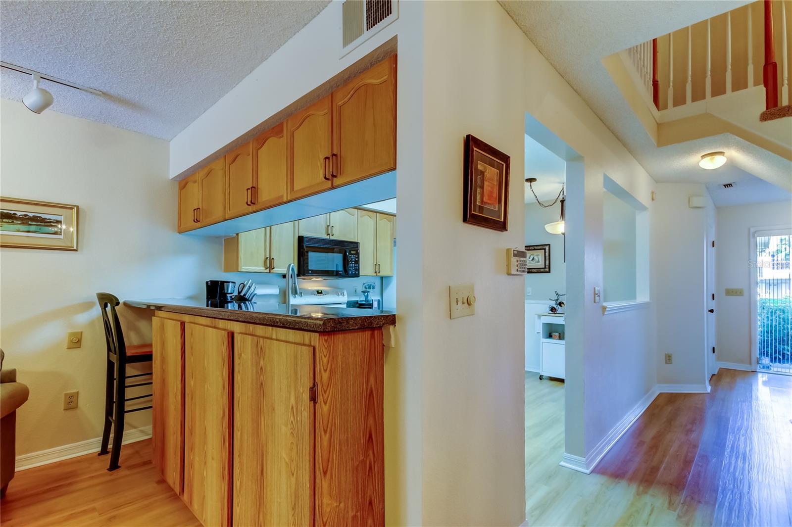 35. Breakfast Bar is Long.. w/ Cabinets on Living Room Side for Extra Storage Needs!