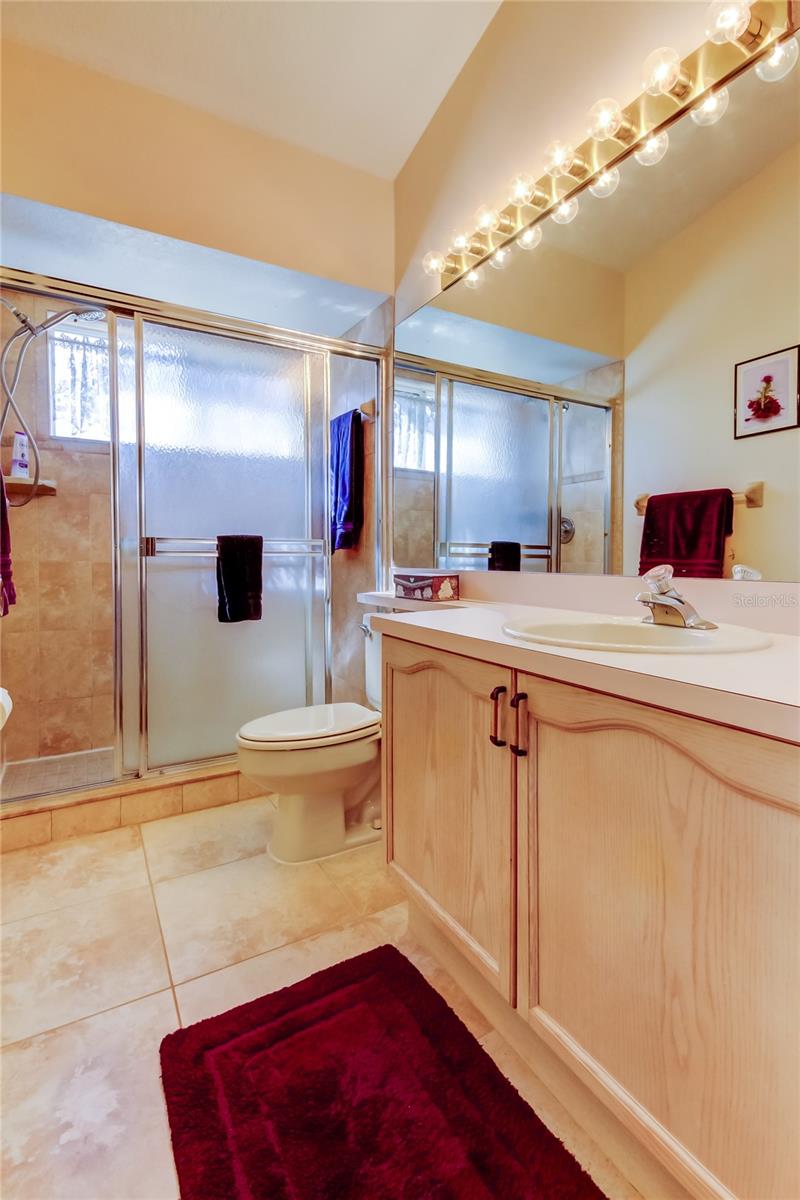 49. Owner's Retreat FULL Bathroom (9.5' x 4.10') is Perfect! Nicely Tiled Walk In Shower (w/Window!), Oversized Vanity .. Tile Floors..