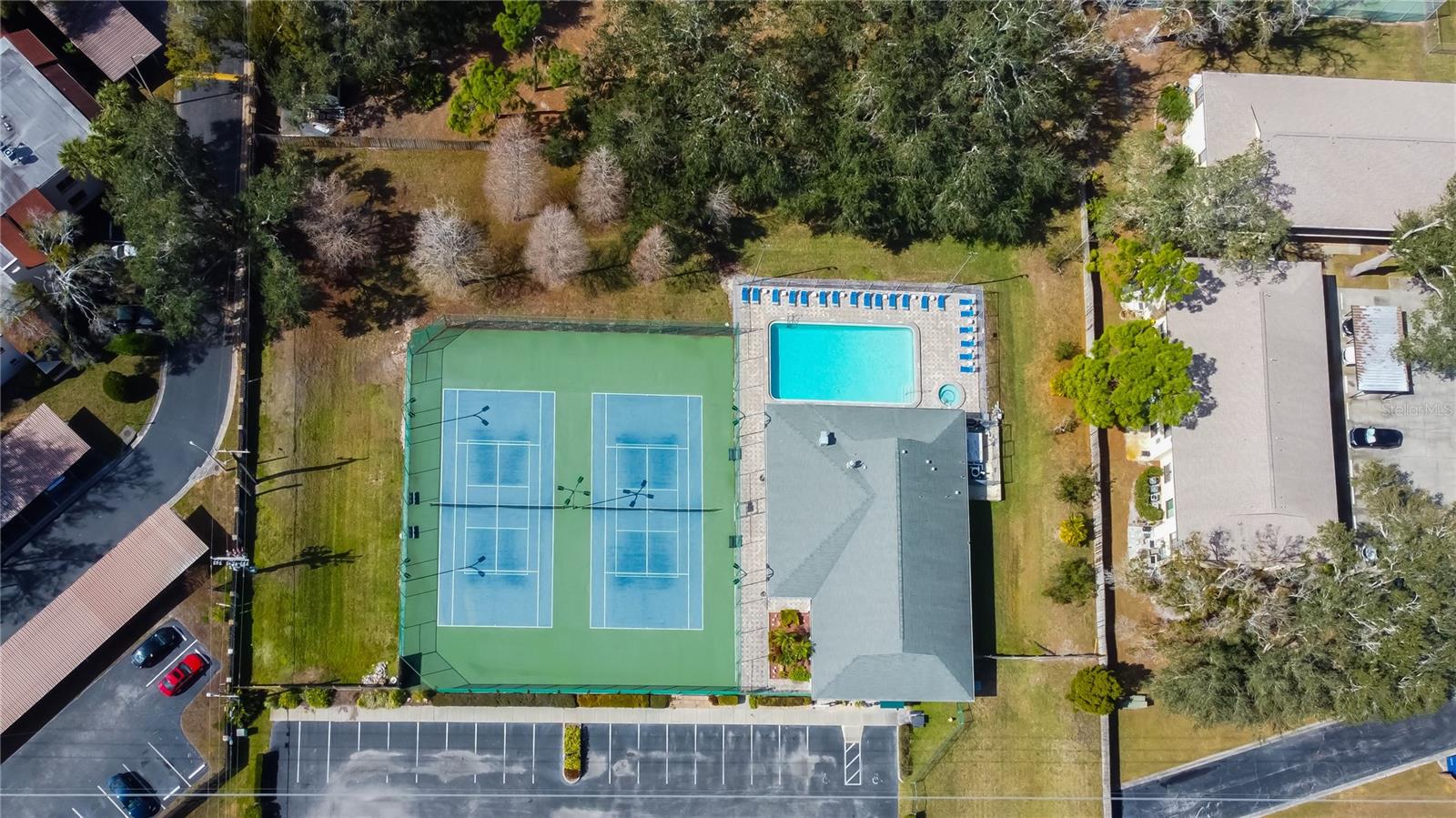 68. Aerial Views of Amenities on the West Edge = You Have a HUGE Clubhouse w/ Full Kitchen.. Available to Rent Out! Alongside Another Lake, Pool, Hottub, Tennis / Pickleball Courts!