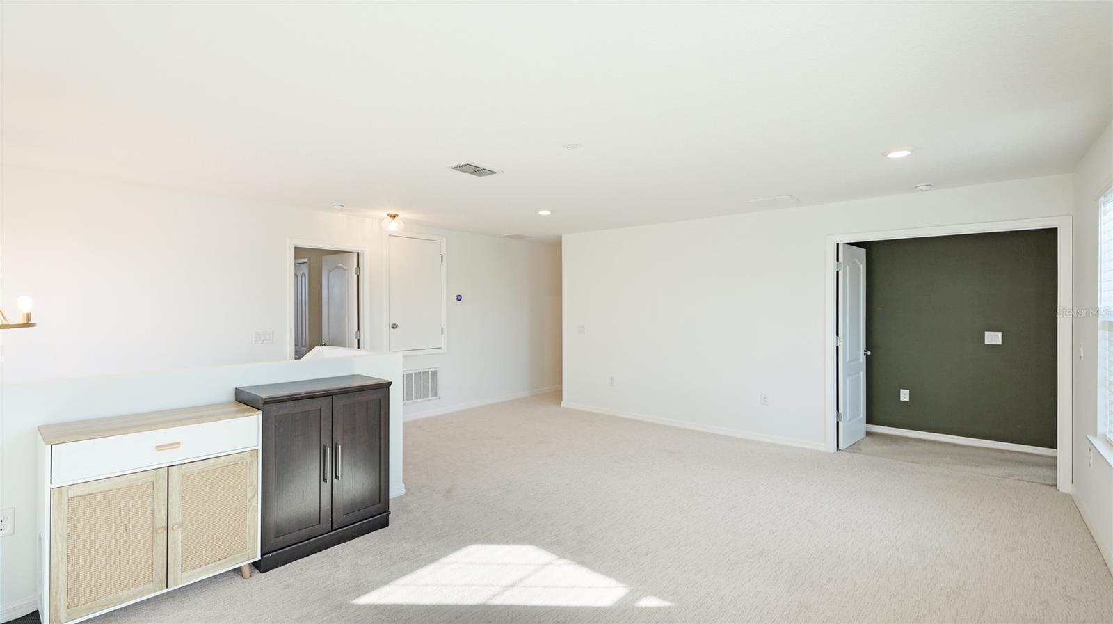 Loft with Primary Bedroom to the right & bedrooms to the left