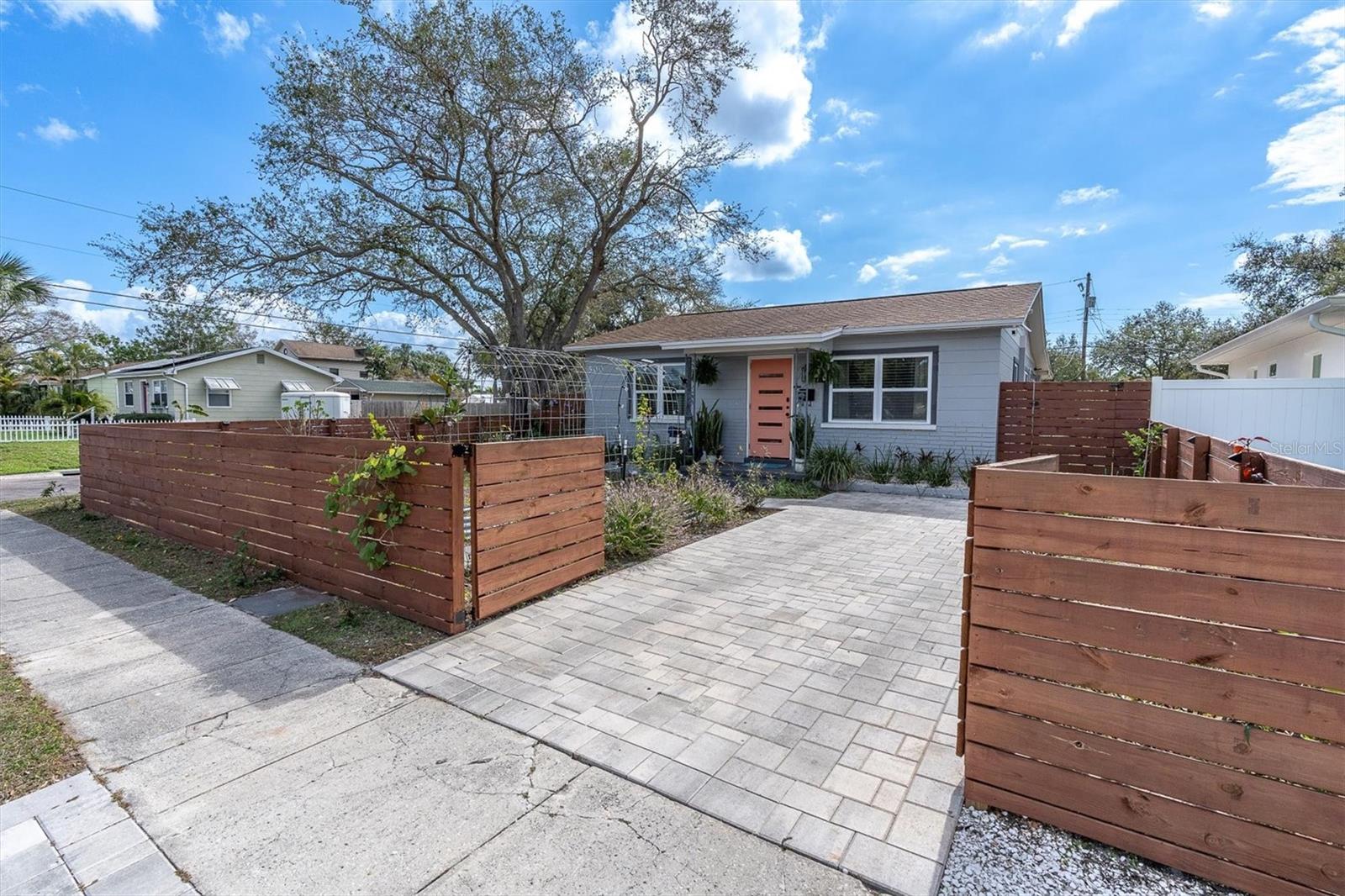 Gated Front Entry with Brick Pavers leading to Front Entrance