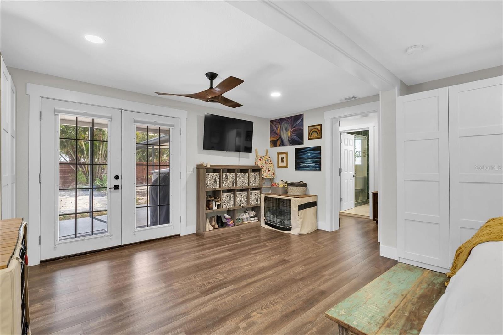 Very Spacious Primary Bedroom with ceiling fans, recessed lights, natural light, and lots of closet space. French Doors lead to great backyard for entertaining.