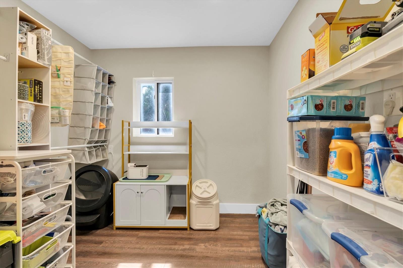 Walk-in closet and storage area in Primary Suite