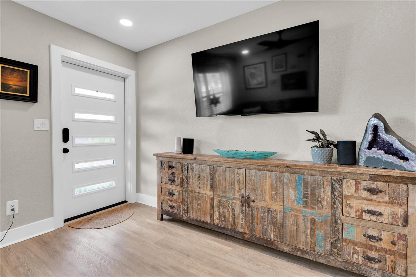 Living Room with Luxury Vinyl Tile, Celing Fan, Custom Blinds, and Recessed Lights