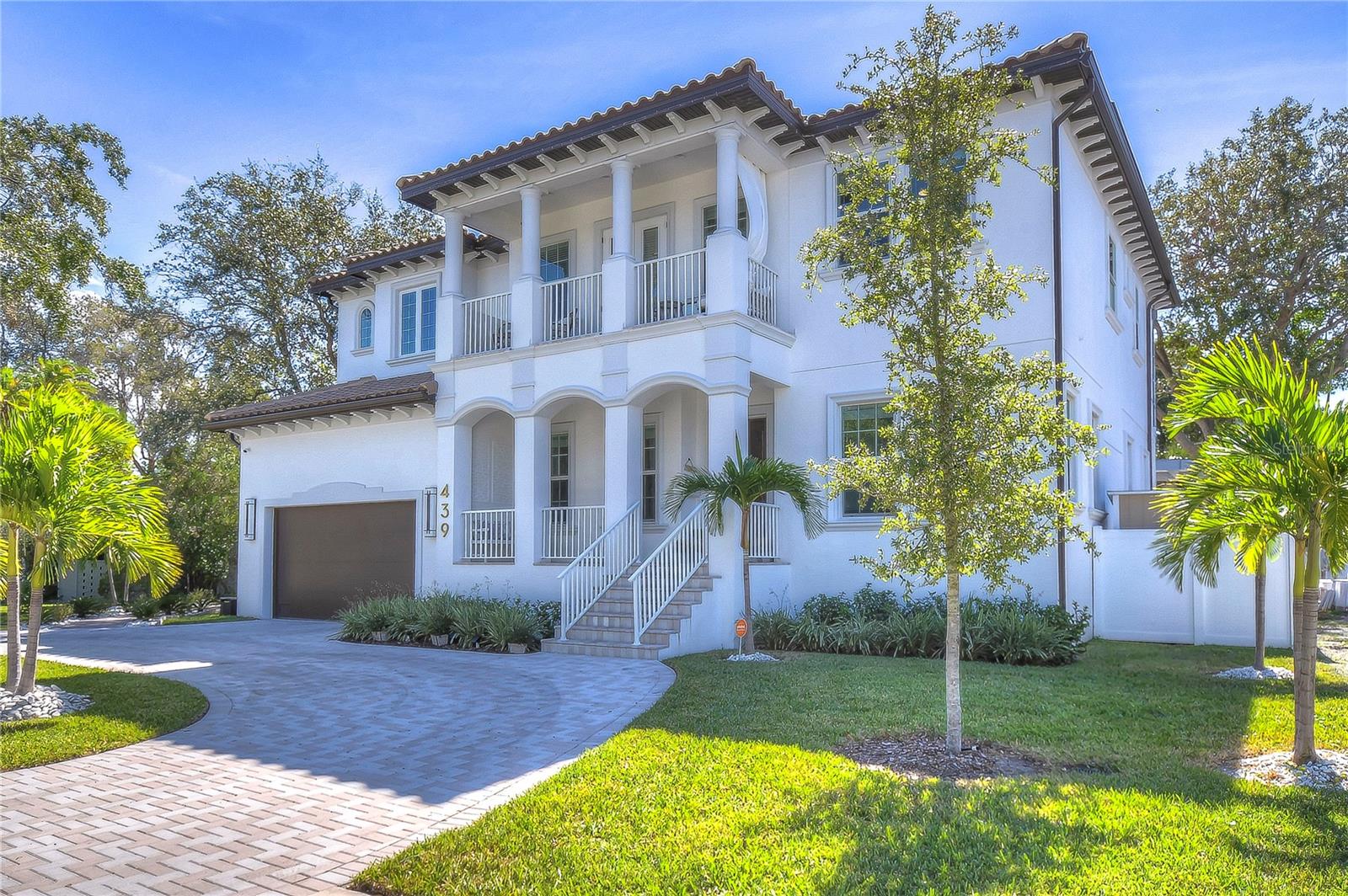 Embrace luxury living in this impeccable seven-bedroom retreat, surrounded by lush palms and serene landscapes.