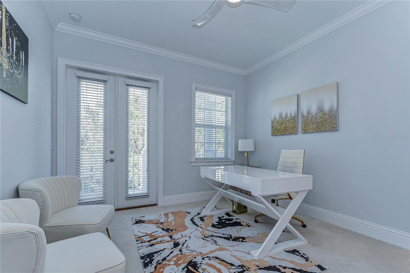 This elegant third bedroom is flexible and bathed in natural light.