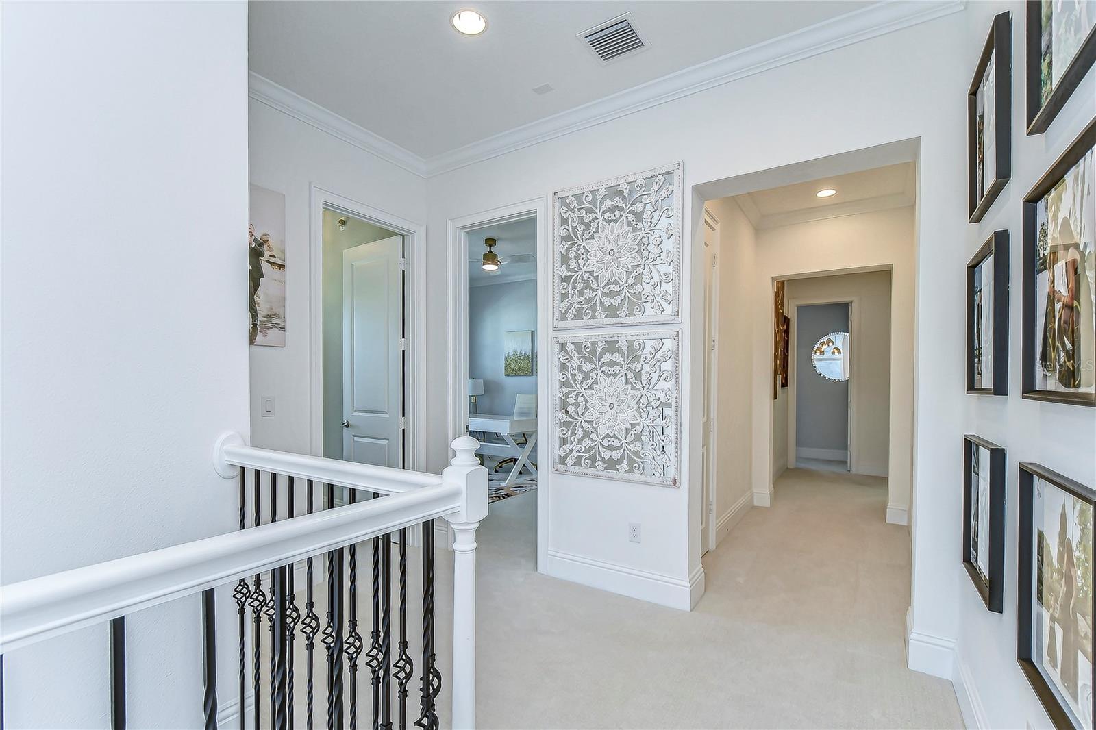 Step into elegance with this refined hallway showcasing exquisite moldings