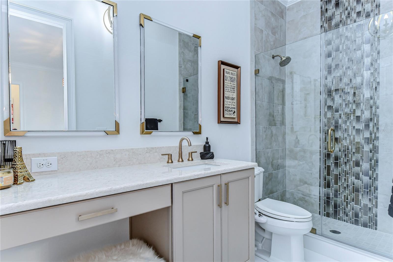 The luxurious marble countertop and refined finishes exude sophistication and modern charm, offering a serene retreat in the fourth bathroom.