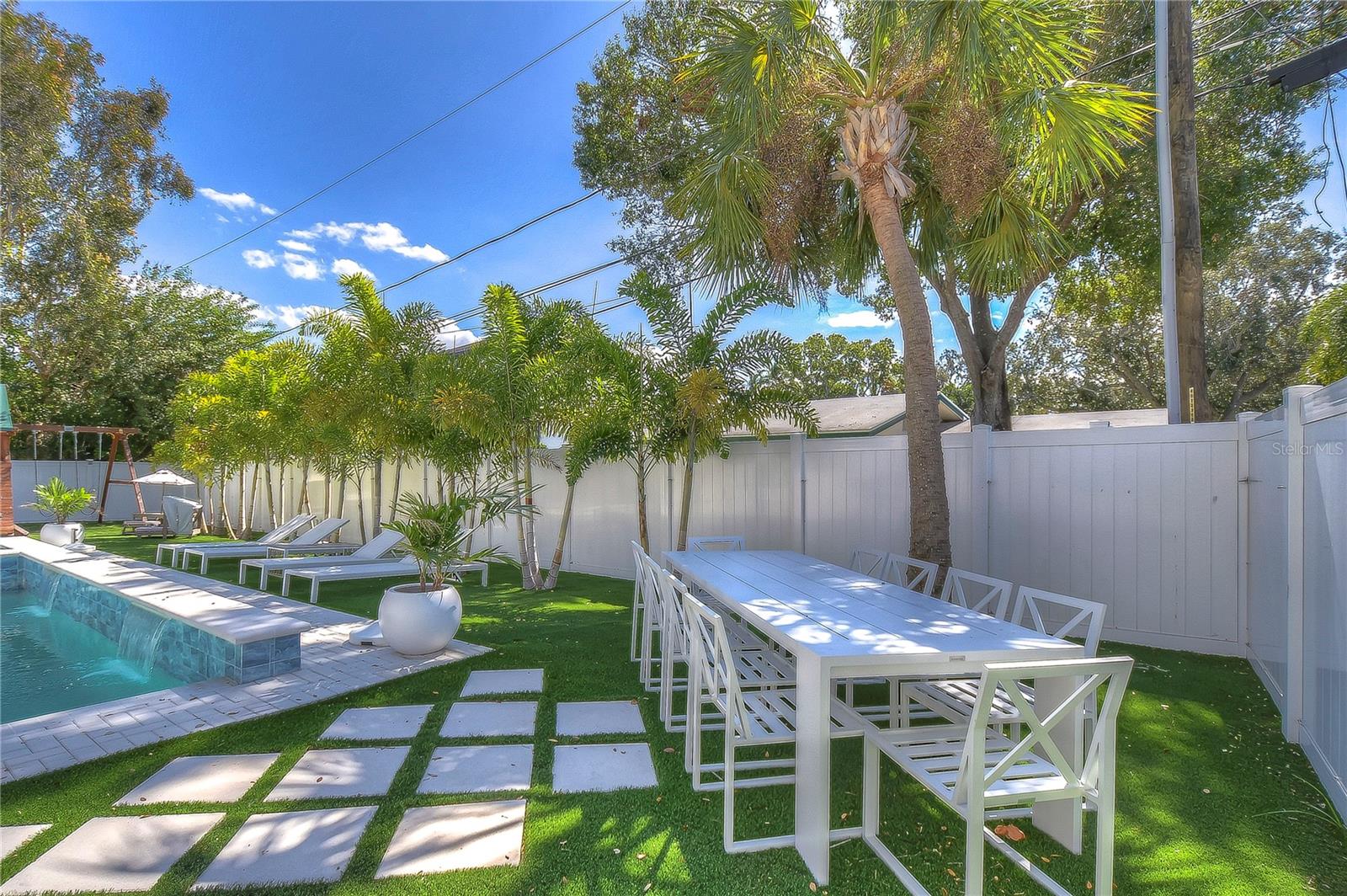 Bask in subtropical serenity by the pool and enjoy elegant al fresco dining.