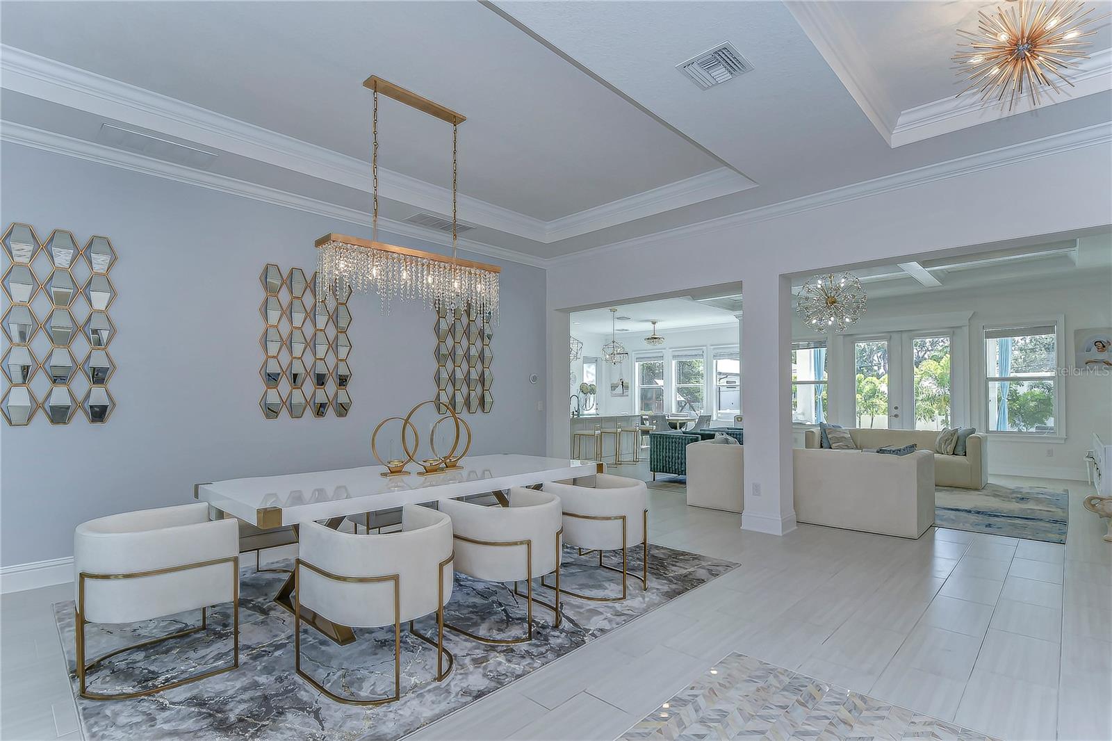 r. Perfect for hosting lavish dinners, the open layout extends into a sunlit living space.