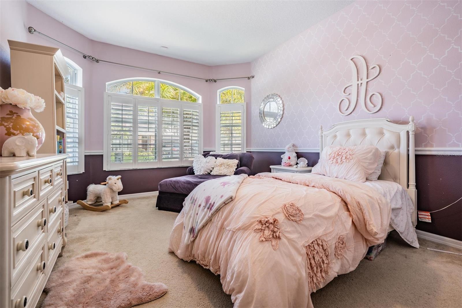 Bedroom 2 with shutters on the windows