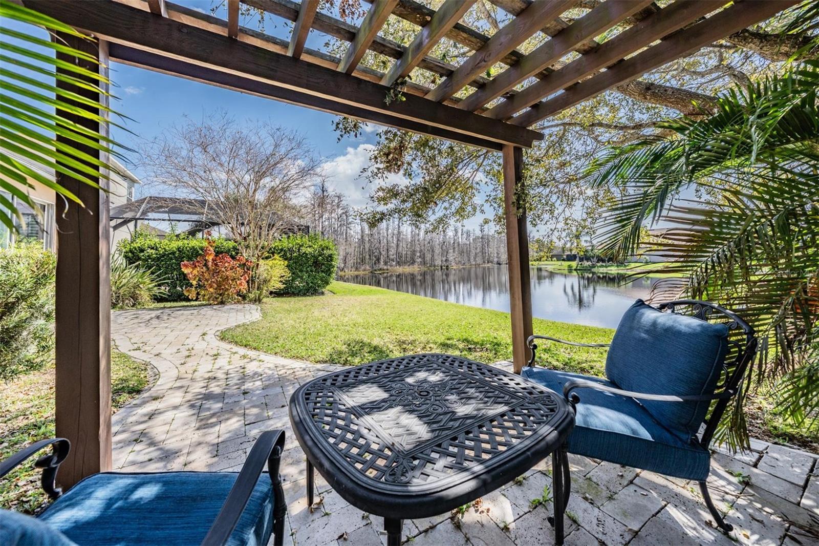 Custom awning on a pavered patio is the perfect place to start or end your day!