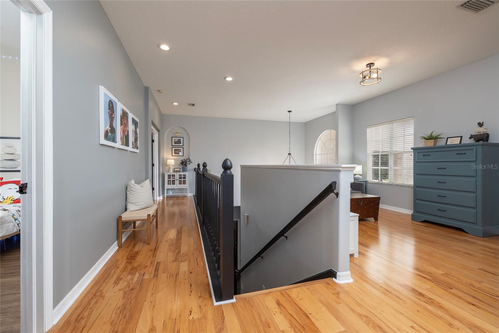 Upstairs, walkway leading to Master on the left, loft on the right leading to large Bonus Room