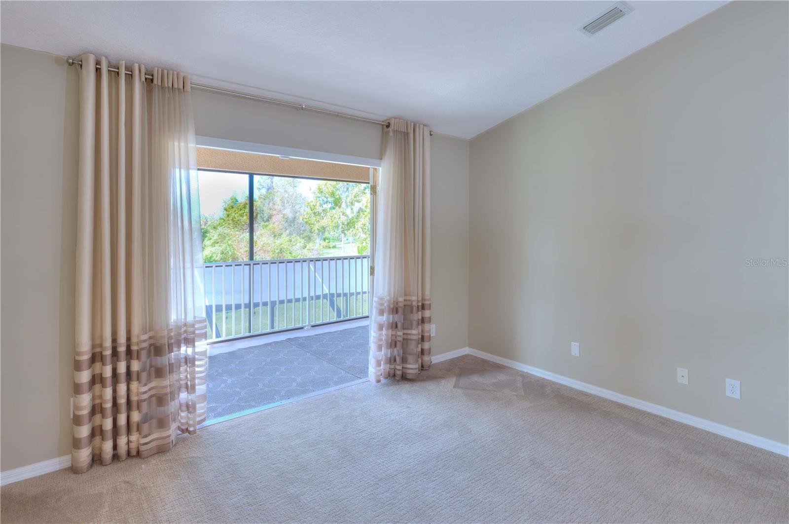 Master bedroom sitting rooms that has double French Doors leading to to the 8' x 29' 2nd floor balcony that overlooks the lanai & backyard.