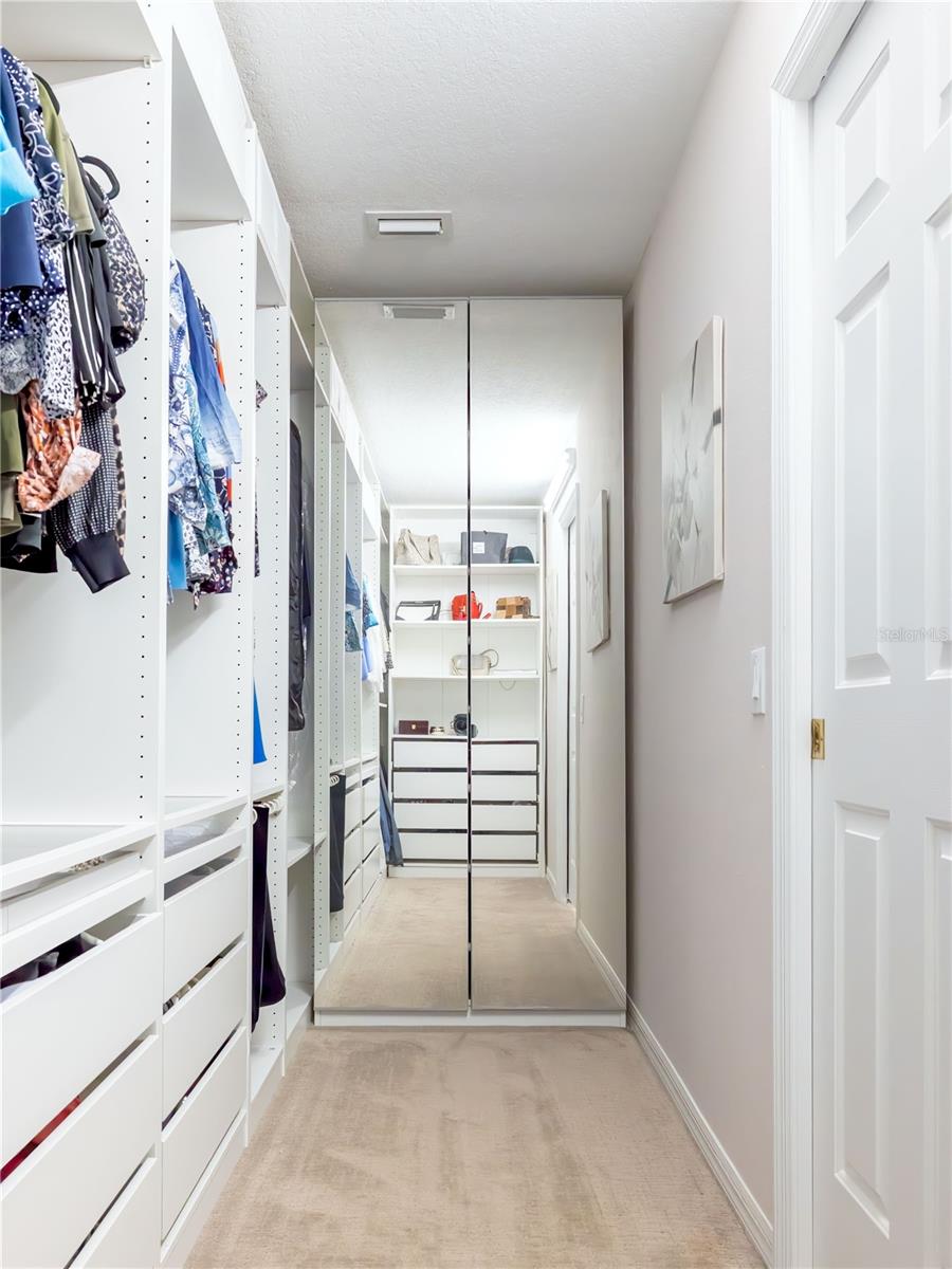 One of two master walk in closets with built-ins!