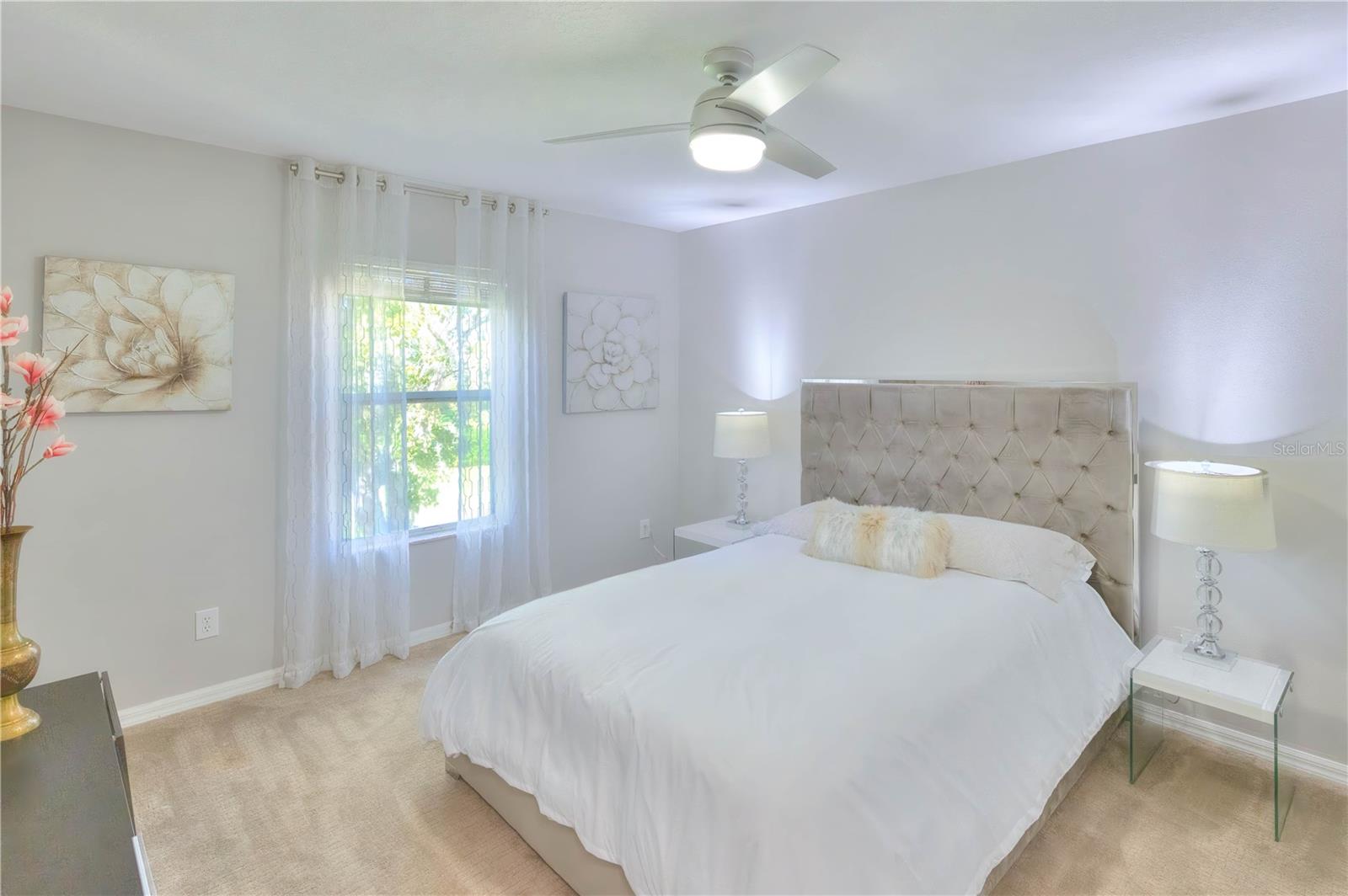 Bedroom 3 overlooks the backyard & features a walk-in closet & designer fan.