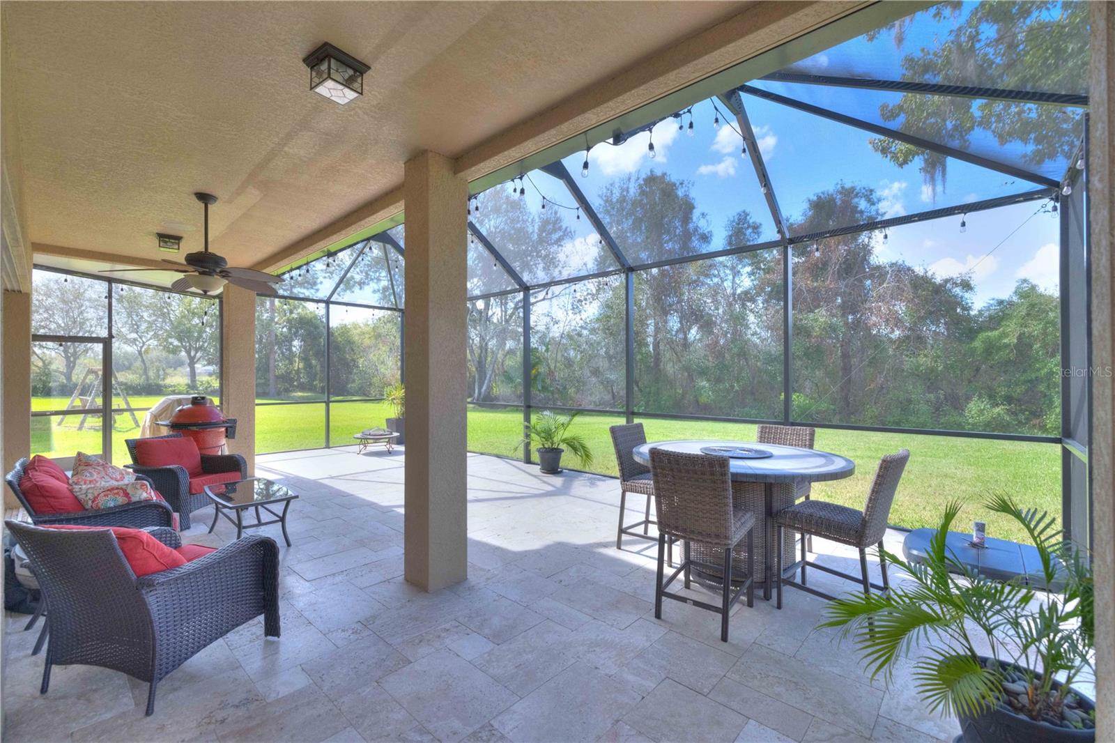 Expansive 19' x 34' partially covered lanai features Travertine floors, mood lighting & lots of privacy with no rear neighbors!