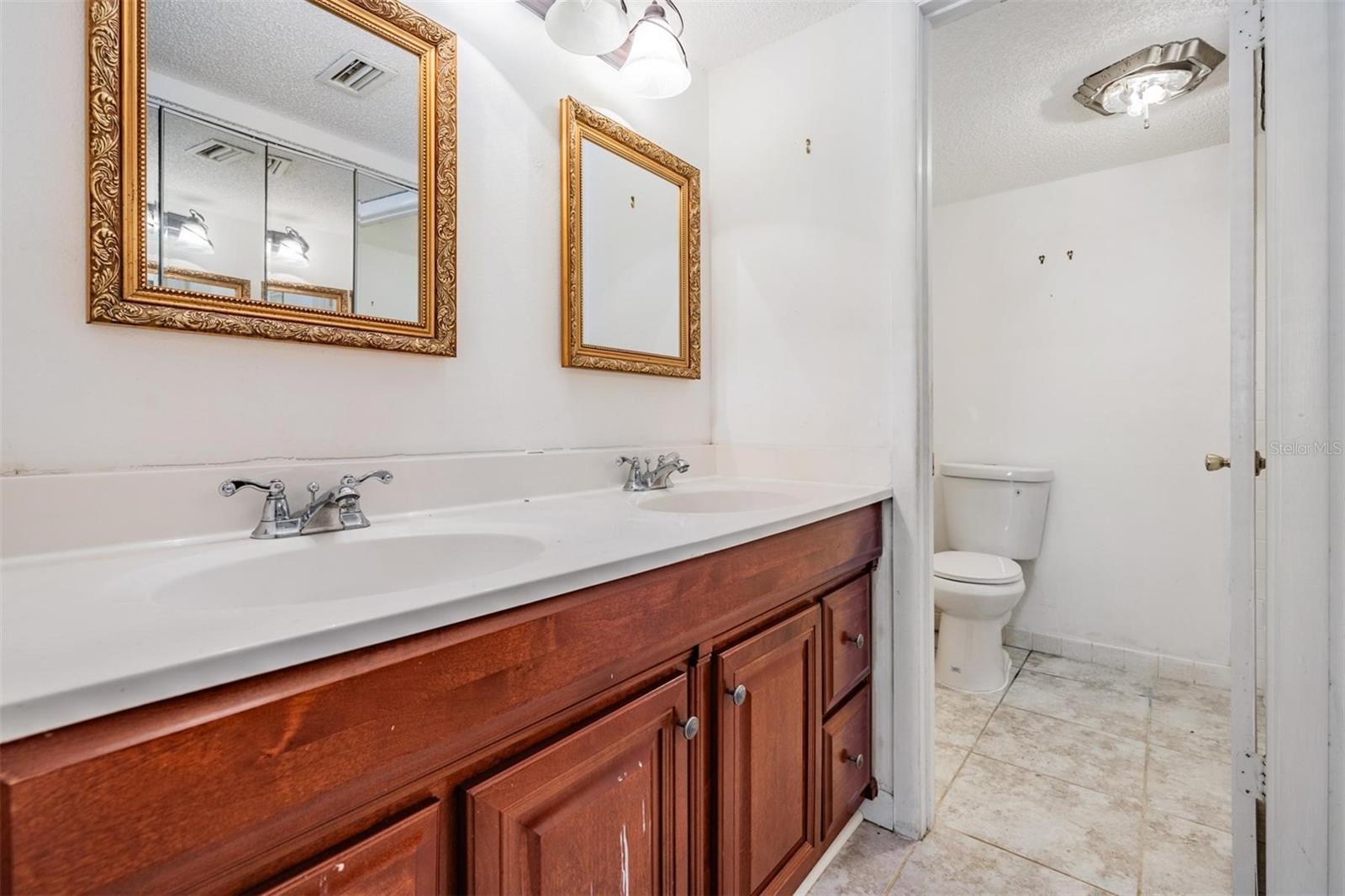 Double vanities in attached bathroom