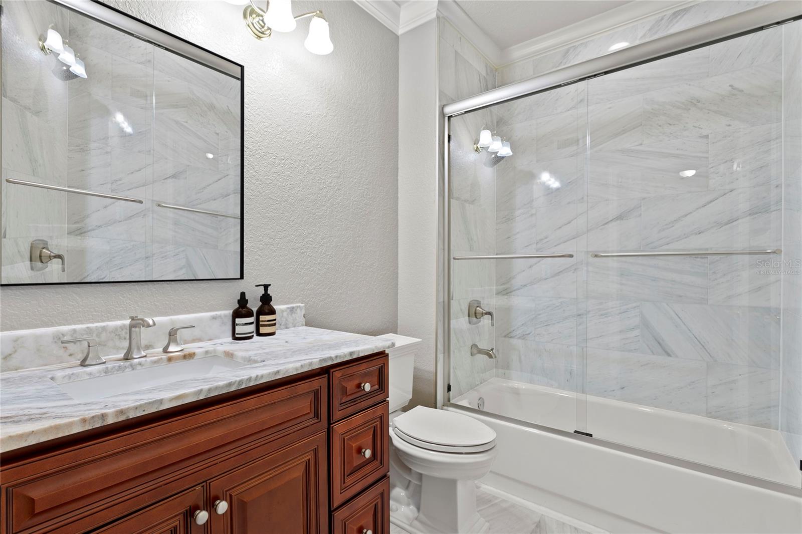 Virtually staged image - beautiful secondary bathroom recently renovated in 2022