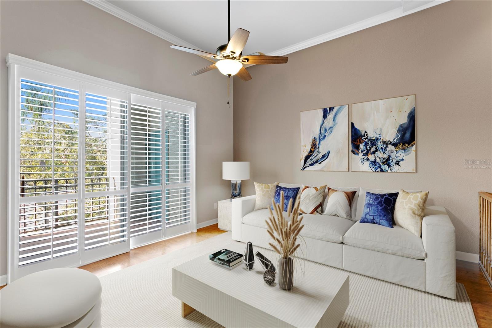 Virtually staged image of the open living room that extends to a balcony