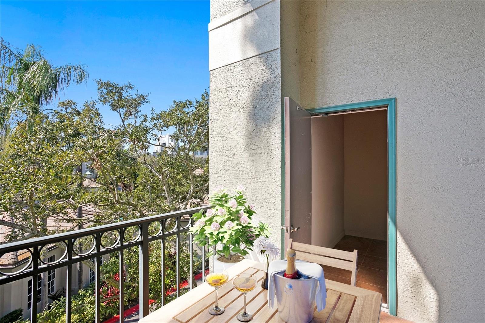 Virtually staged image, The spacious balcony (with an oversized storage closet) extends the living area outdoors enjoys peek-a-boo views toward the City skyline.