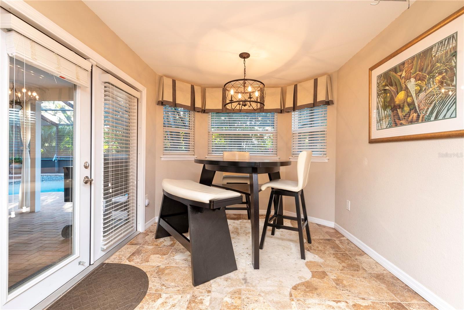 Breakfast nook with French doors to the pool lanai.