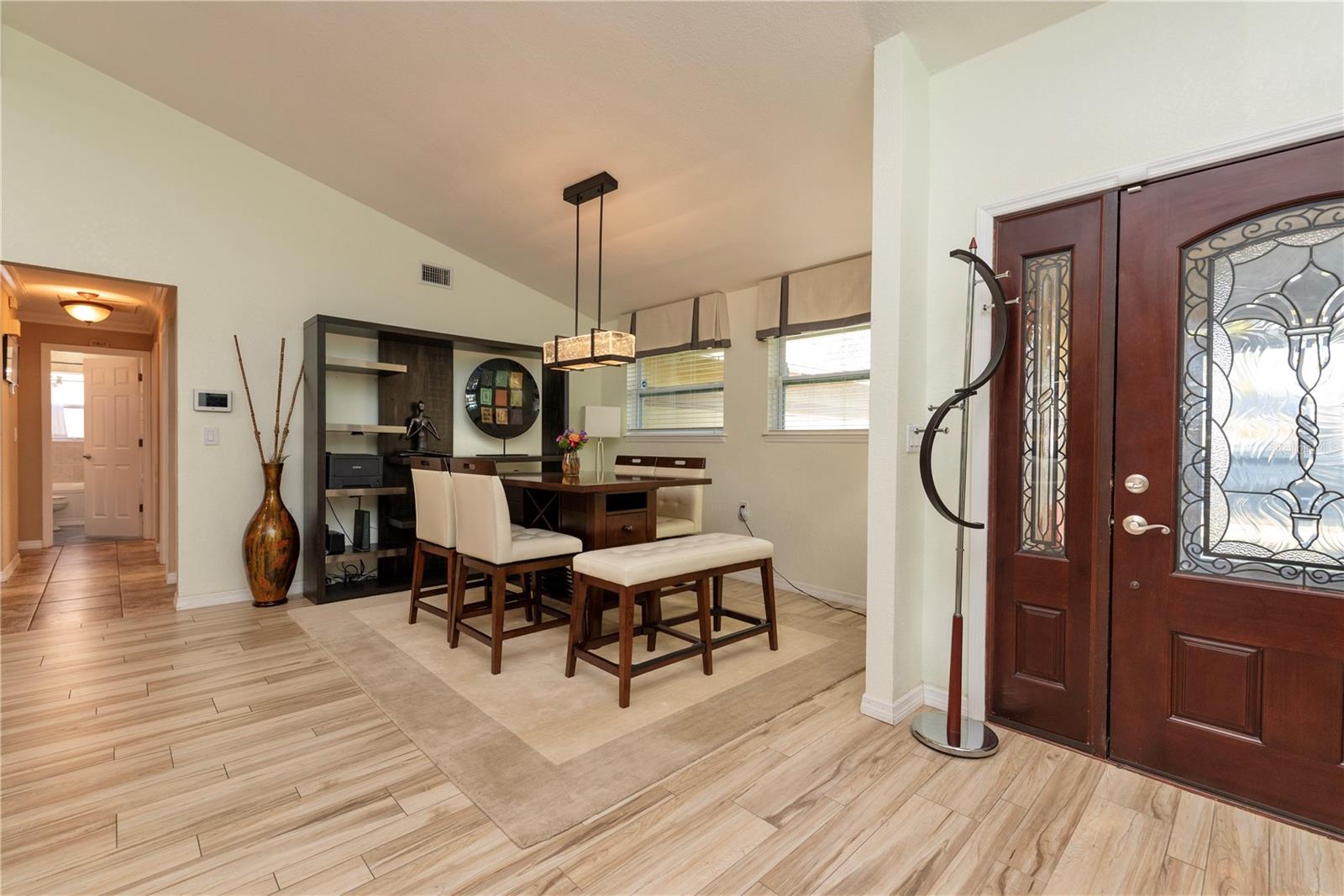 Dining room with cathedral ceilings.