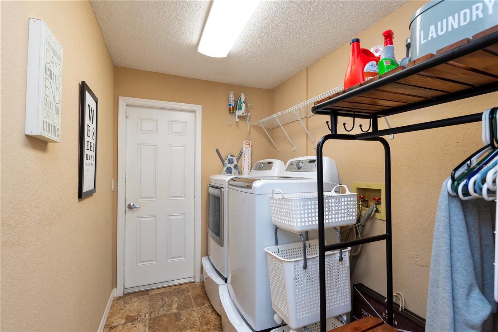 Inside laundry and utility room (washer & dryer do not convey).