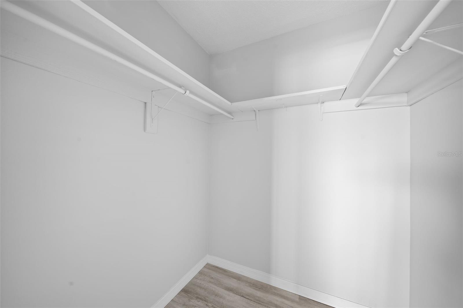 Primary bedroom walk-in closet