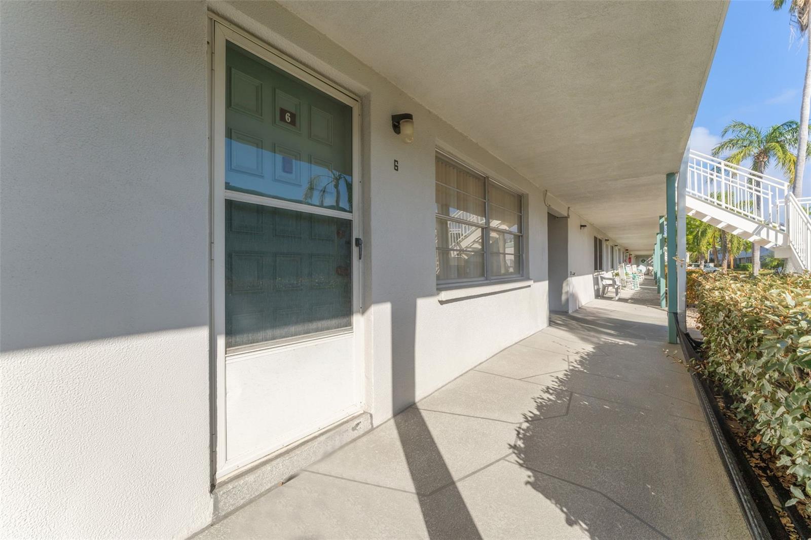 Back door to your condo, put out a couple of chairs and enjoy the day.  You look onto the inner courtyard.