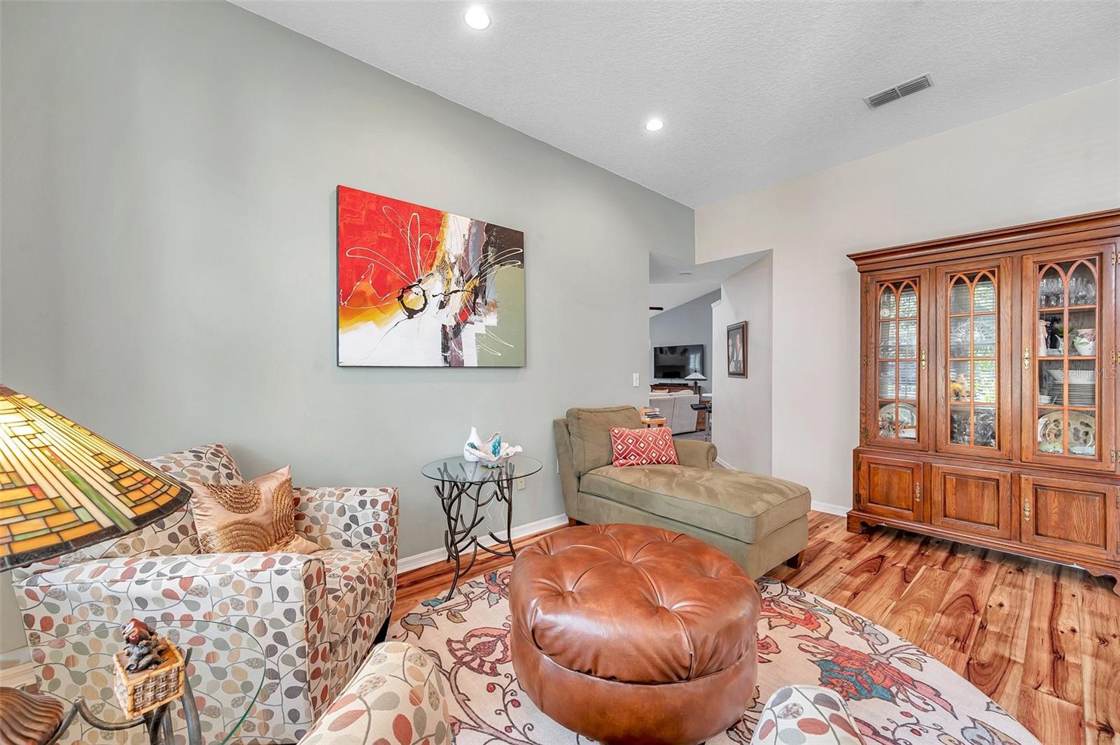 Formal living room featuring vaulted ceilings and inset lighting