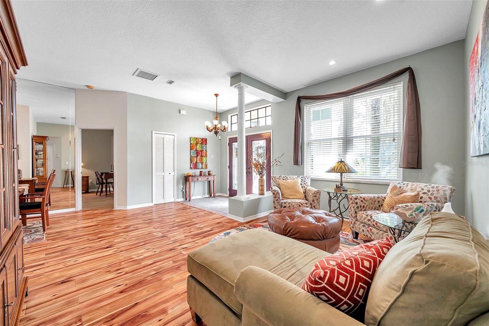 The light and bright formal living room and foyer