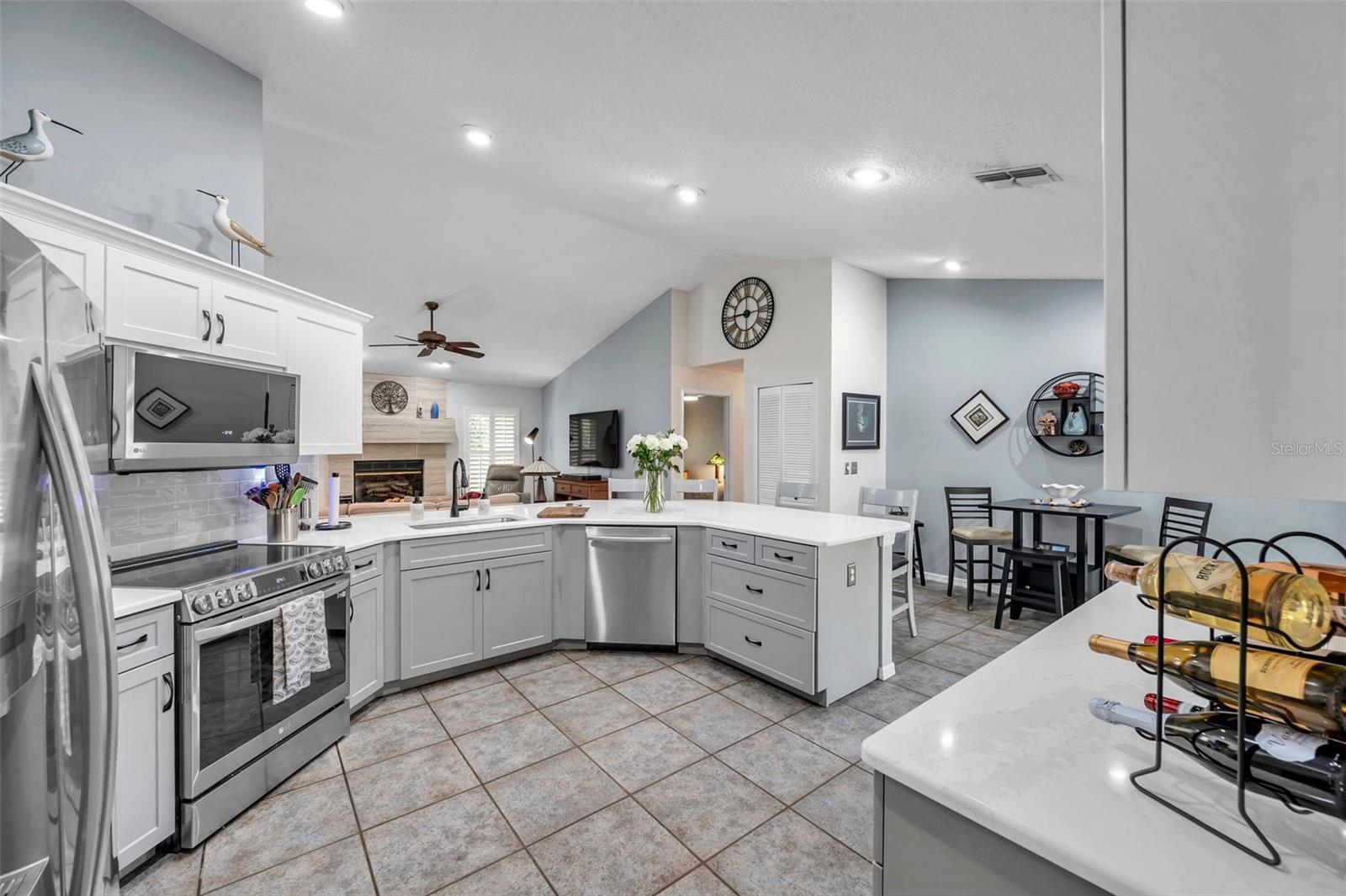 The spacious remodeled kitchen provides abundant cabinetry and counter space