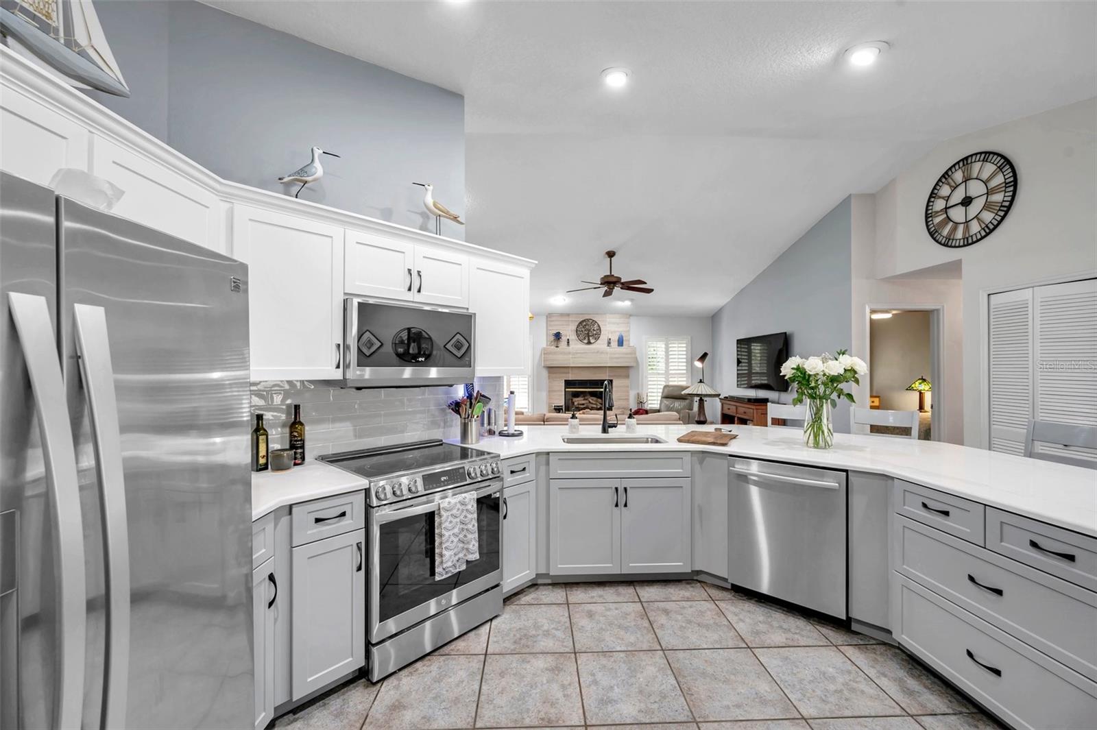 The newer appliances are stainless steel to go with the modern remodeled kitchen