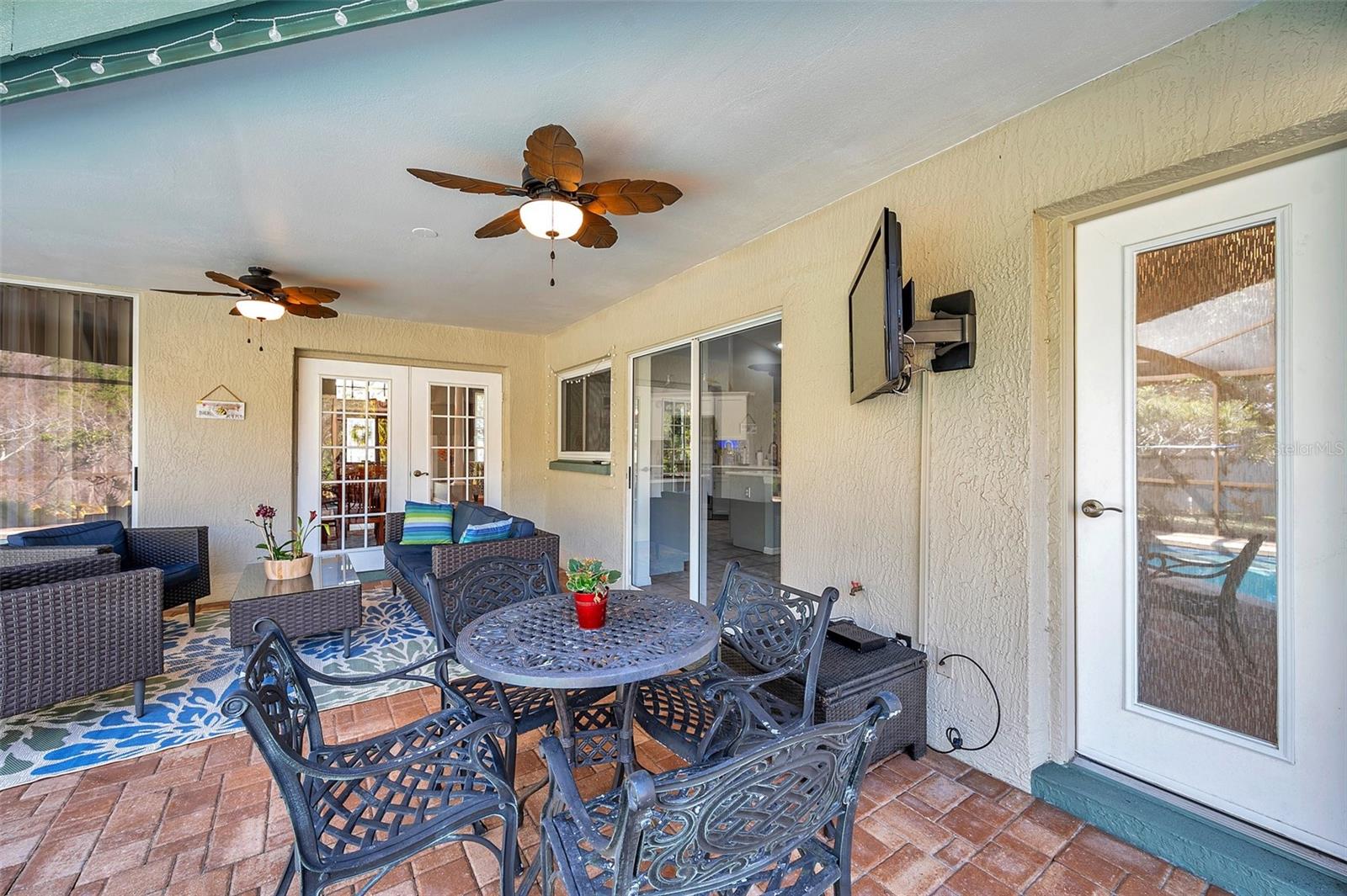 The updated guest bath opens out to the pool deck to double as a pool bath