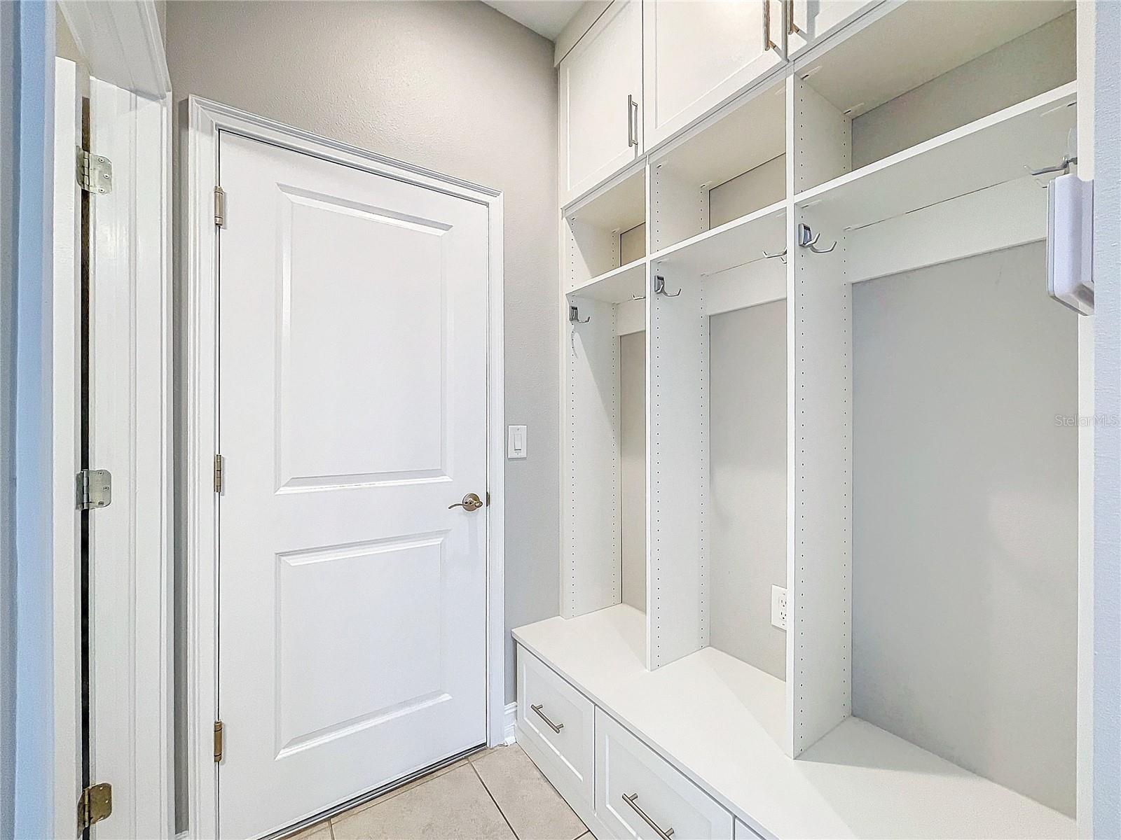 Mud Room, leading to 1/2 bath & garage entry