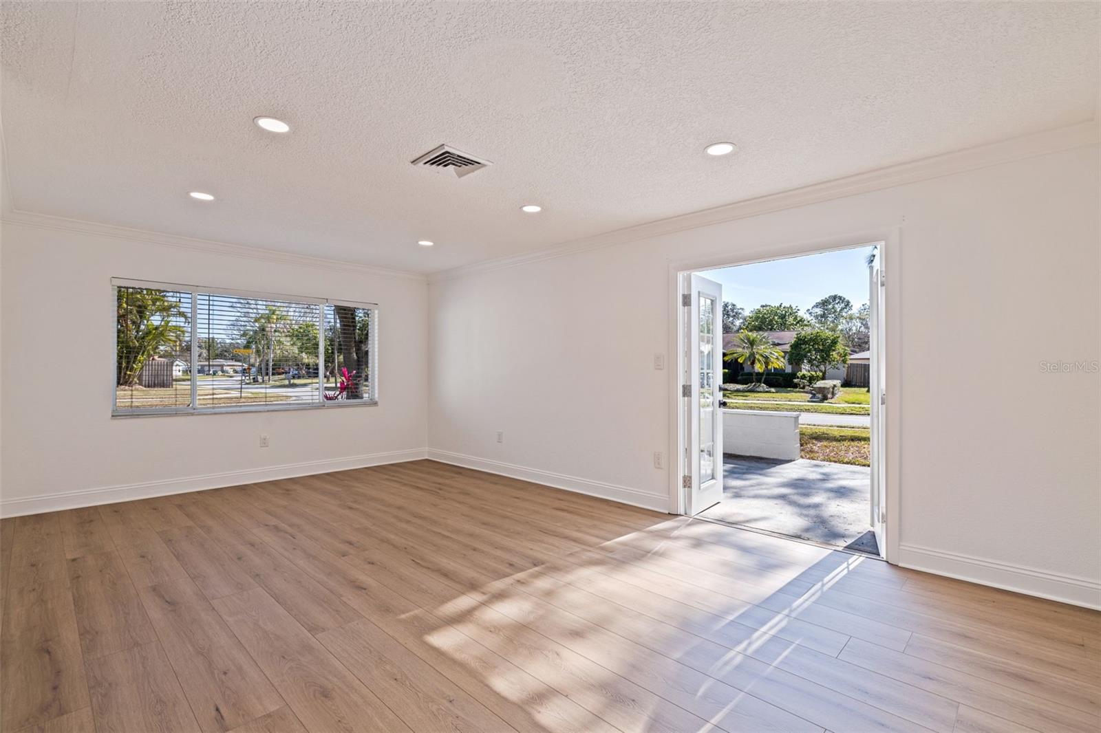 Living Room with doors leading out to side porch