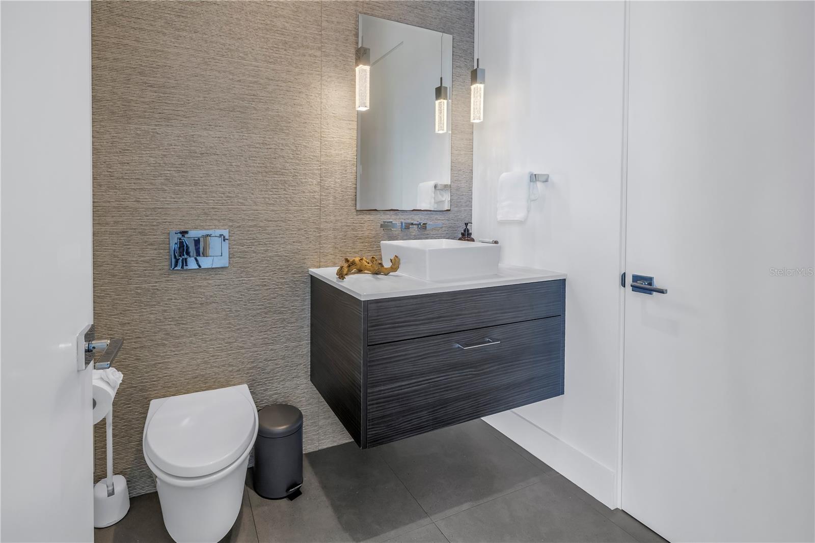 Guest bathroom with floating vanity.