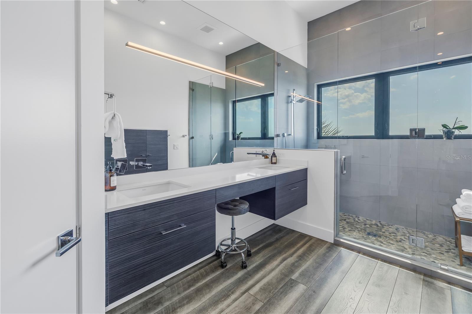 Primary bathroom with dual vanity.