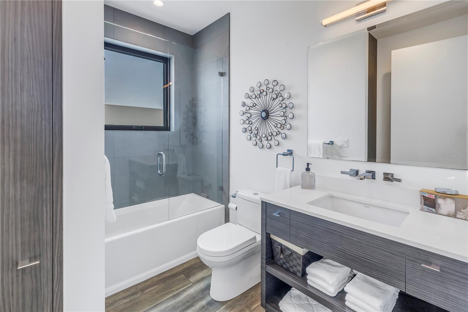 Guest bathroom with shower/tub combo.