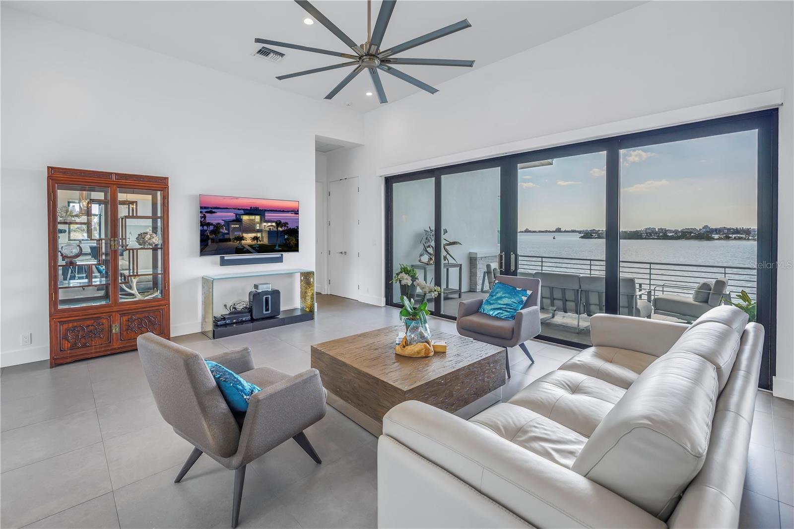 Sliding glass doors lead to large balcony.