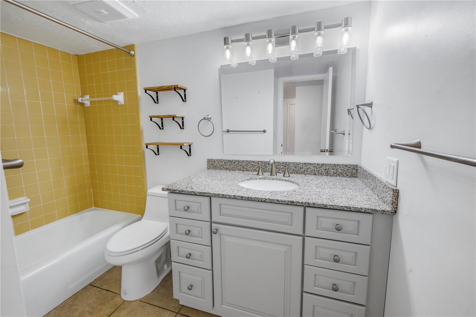 Bathroom offers an updated vanity.