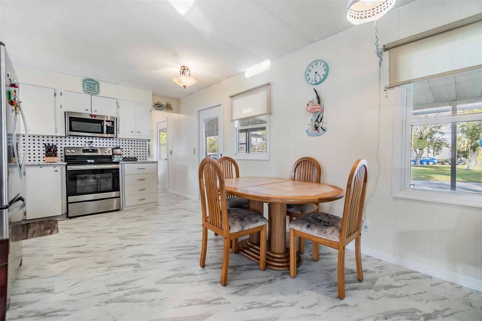 Dining room is open with kitchen and living room.