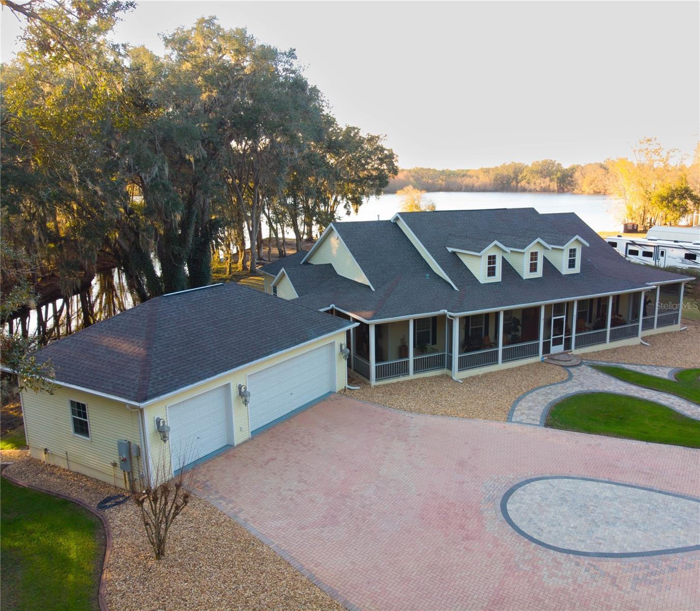 Aerial view of home with lake in the background