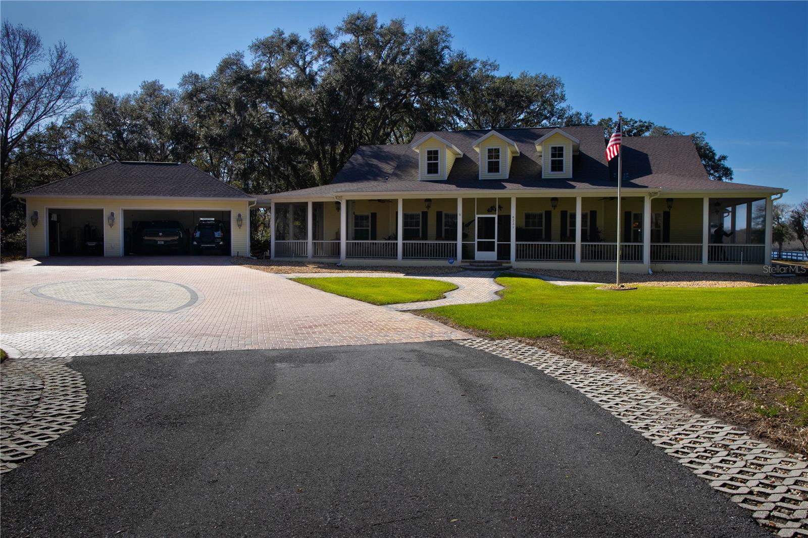 Long private tree lines drive up to house