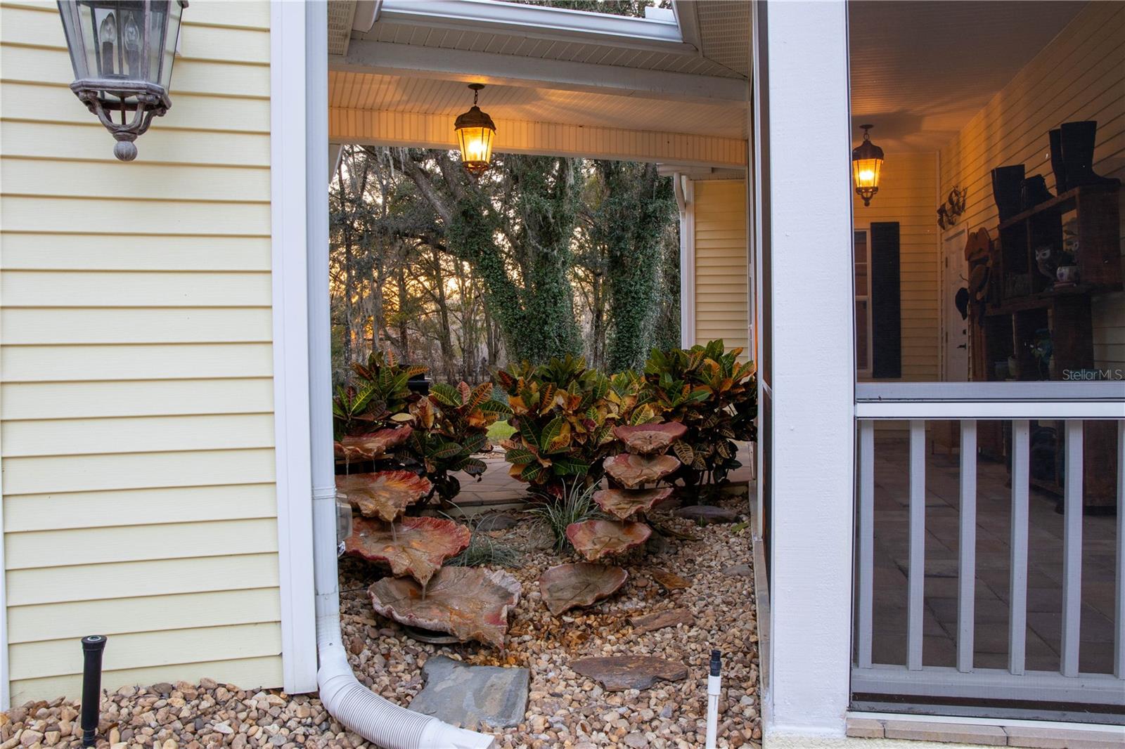 Water fountain between garage and house