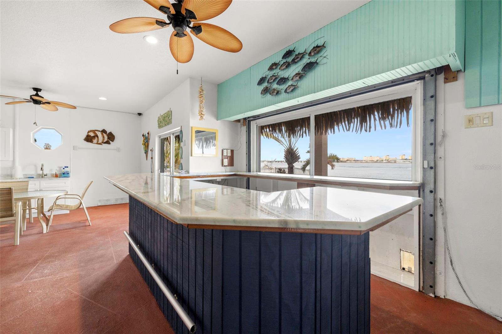 Custom bar with granite counter tops and passthrough to poolside - great for entertaining