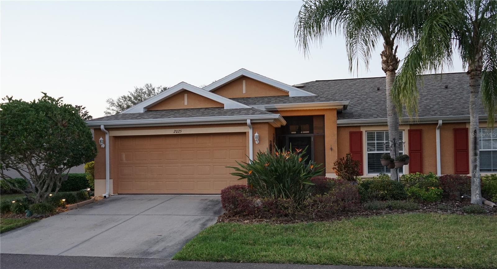 front with screened entry and 2 car garage